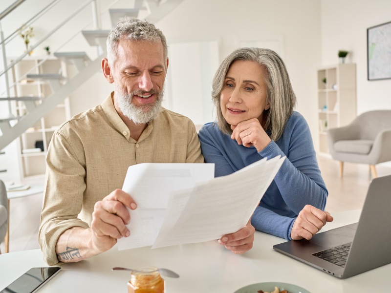 couple going over retirement strategies at kitchen table